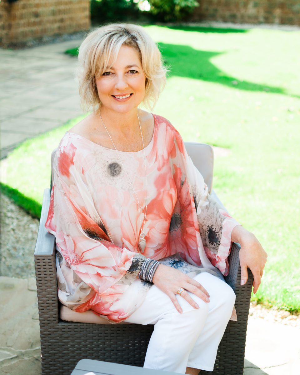 Lynne James sitting in her garden