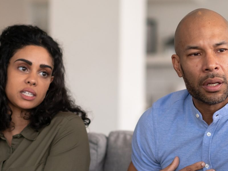 A couple talking through their situation in a meeting